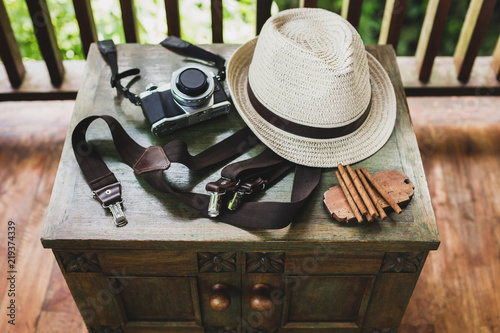 Photography Male set: cigars, whiskey, hat, suspenders and camera on vintage a wooden table