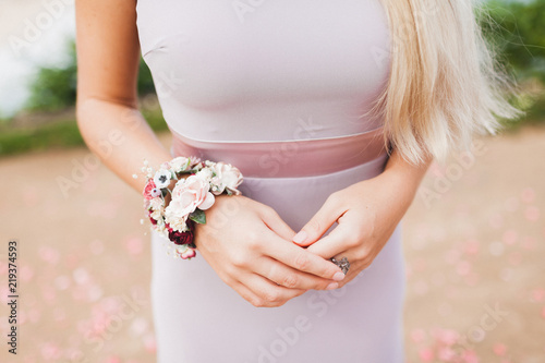 Photography Flower bracelet on woman hands