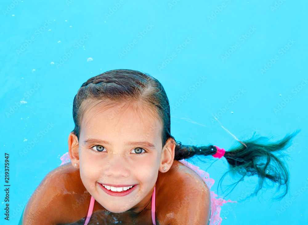 Cute smiling happy little girl child in swimming pool Stock Photo ...