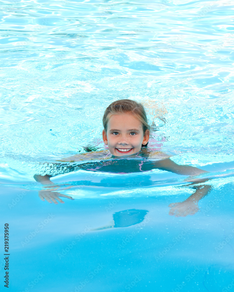 Cute smiling happy little girl child in swimming pool Stock Photo ...