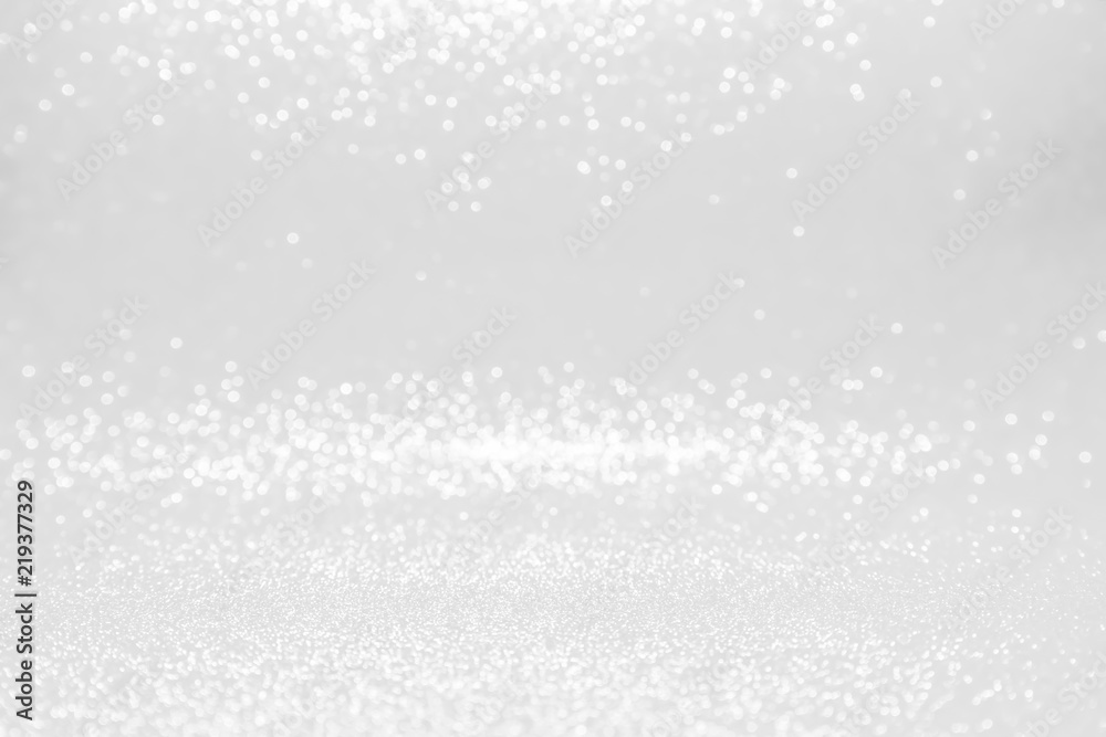silver and white bokeh lights defocused. abstract background silver and white bokeh lights defocused. abstract background