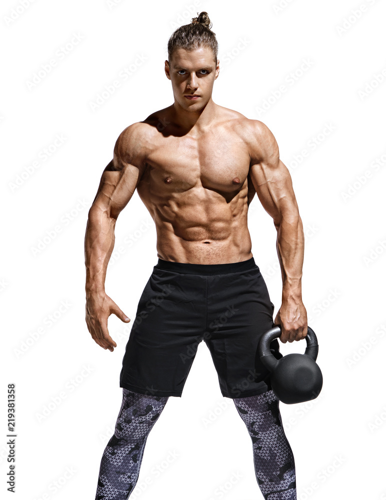 Sporty man resting after workout with kettlebell. Photo of handsome man with naked torso and good physique on white background. Strength and motivation