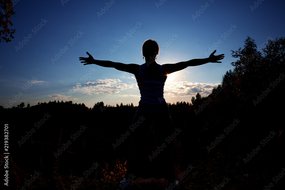 Healthy woman celebrating during a beautiful sunset. Happy and Free. Healthy woman celebrating during a beautiful sunset. Happy and Free.