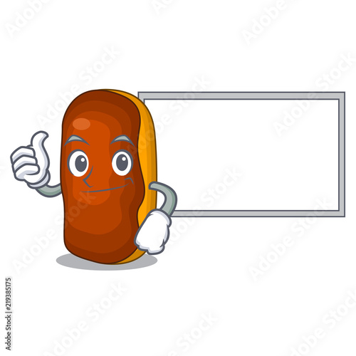 Thumbs up with board character eclair cake isolated on chocolate