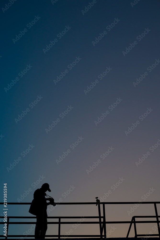 Silhouette of photographer taking photo