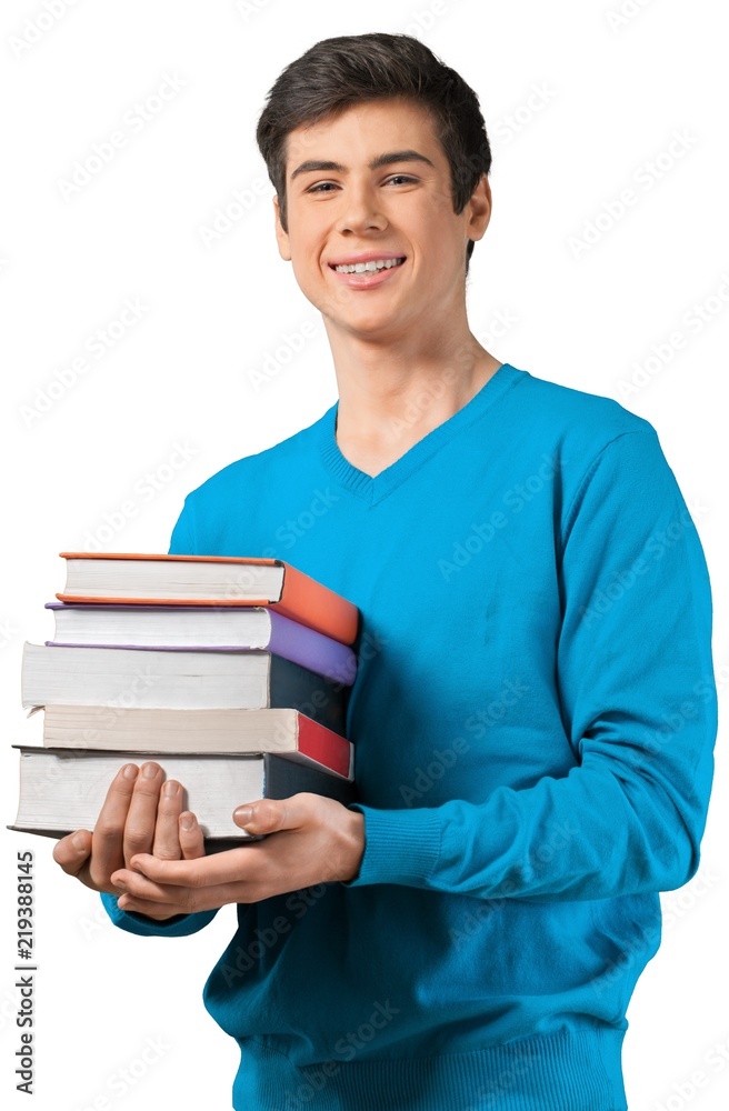 happy young teen holding a stack of books happy young teen holding a stack of books