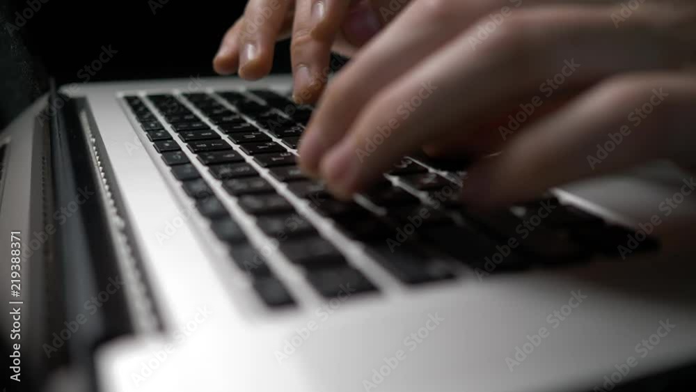 male hands typing on laptop, side view male hands typing on laptop, side view