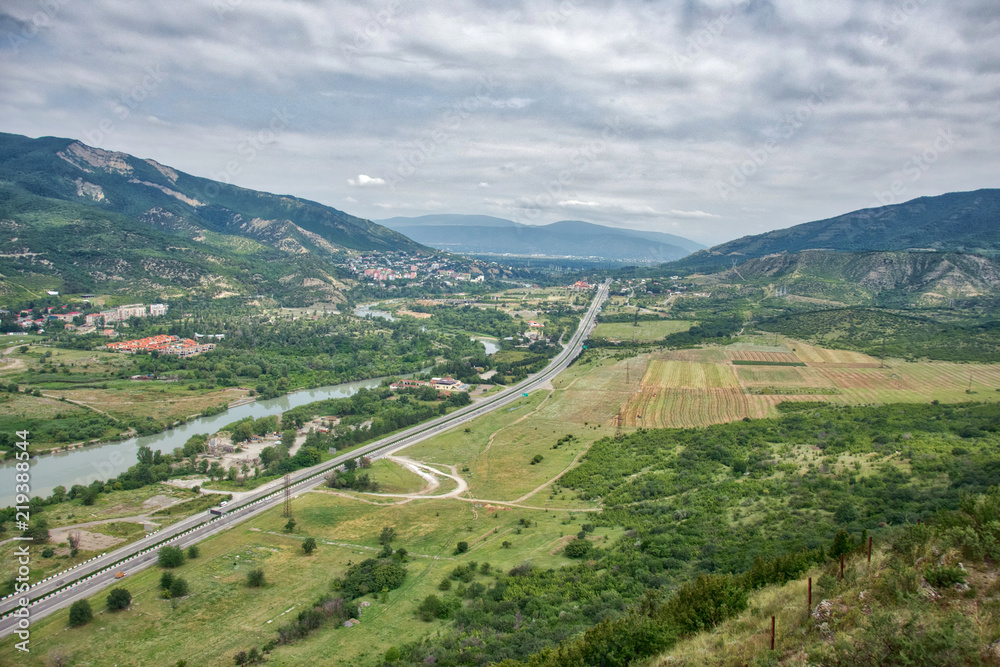 Naklejka premium The road between the mountains