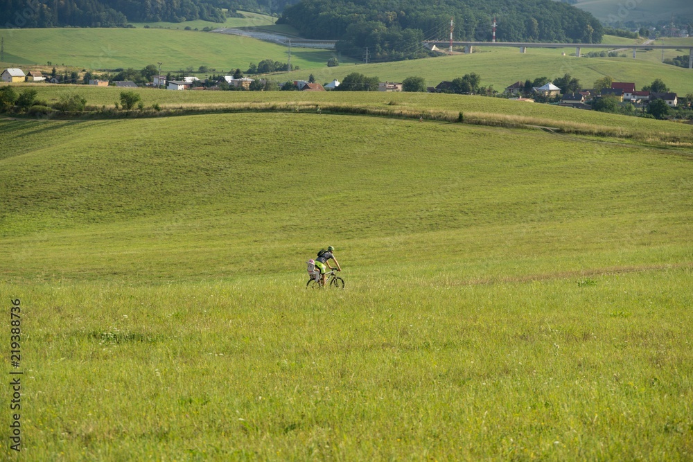 Cyclist on a meadow. Slovakia Cyclist on a meadow. Slovakia