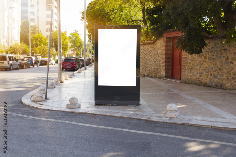Blank mock up of vertical with copy space area for your text message or promotional content next to road Blank mock up of vertical with copy space area for your text message or promotional content next to road