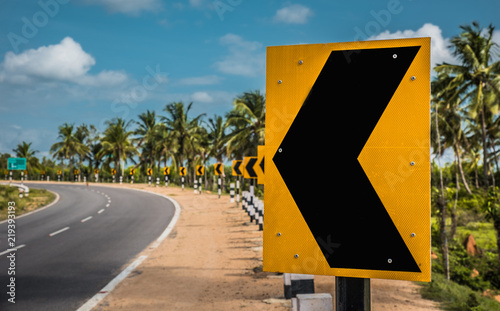 Left Turn Traffic Sign At The Side Of The Road
