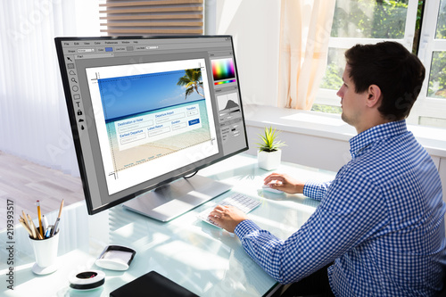 Designer editing photos on computer