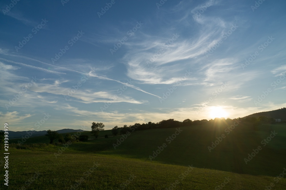 Fototapeta premium Sunrise and sunset over the hills and town. Slovakia