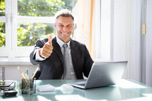 Fotografija Happy Businessman Gesturing Thumbs Up