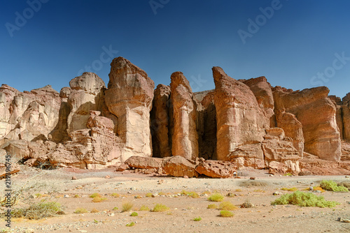 Red Sandstone cliffs in Timna Valley, King Solomon`s Pillars at the first Jewish Temple in Jerusalem, Israel. Panoramic view photo