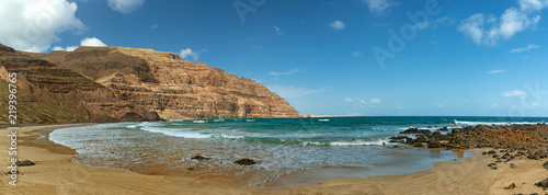 Summer beach panorama, Orzola playa la Cantera in Lanzarote, the Canary Islands photo