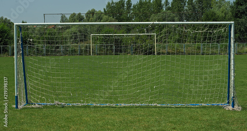 View on two goals on football field, on in front and second in background