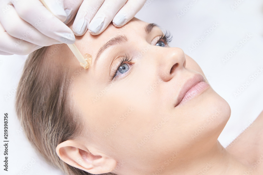 Waxing woman body. Sugar hair removal. laser service epilation. Salon wax beautician procedure