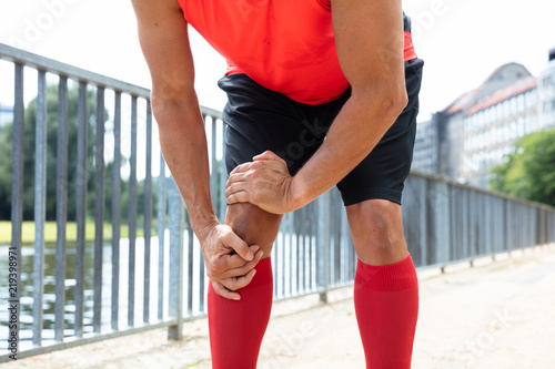 Billede på lærred Jogger Having Pain In His Knee