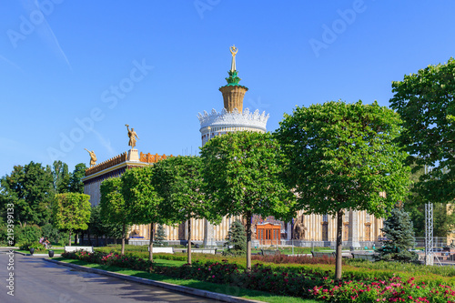 View of pavilion Ukrainian SSR on a background of green trees on Exhibition of Achievements of National Economy (VDNH) in Moscow on a sunny summer morning photo