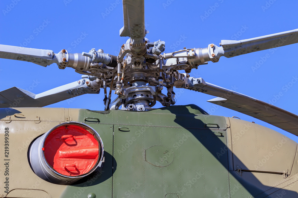 Engines and blades of helicopter MI-8T closeup against blue sky on VDNH in Moscow