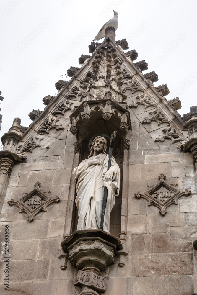 Barcelona, Spain - May 10, 2018: Sculpture of Jesus in gothic crypt in Poblenou Cemetery. Peaceful but macabre, cemetery of Poblenou is today home to incredible sculptures, haunting, yet beautiful.