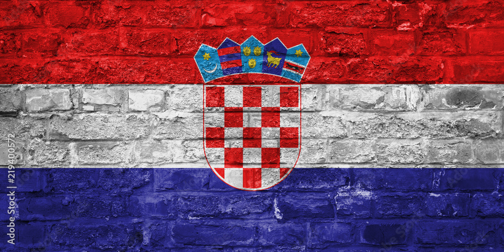 Flag of Croatia over an old brick wall background, surface