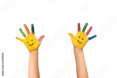 Smile, happiness and fun concept. Happy kid shows painted hands