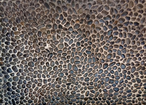 gray sea pebble stone wall texture background