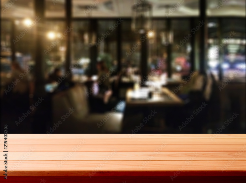 Wood table with blured background cafe , for your photo montage or product display. Space for placing items on the table. Wood table with blured background cafe , for your photo montage or product display. Space for placing items on the table.