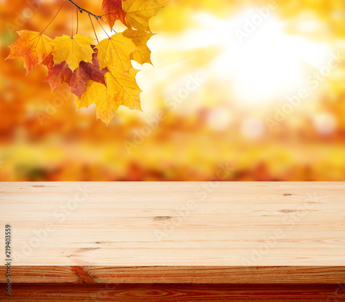Wood table top on shiny bokeh gold background - can be used for display or montage your products