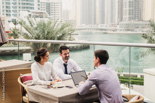 Canvas Print Business meeting on modern balcony in Dubai Marine