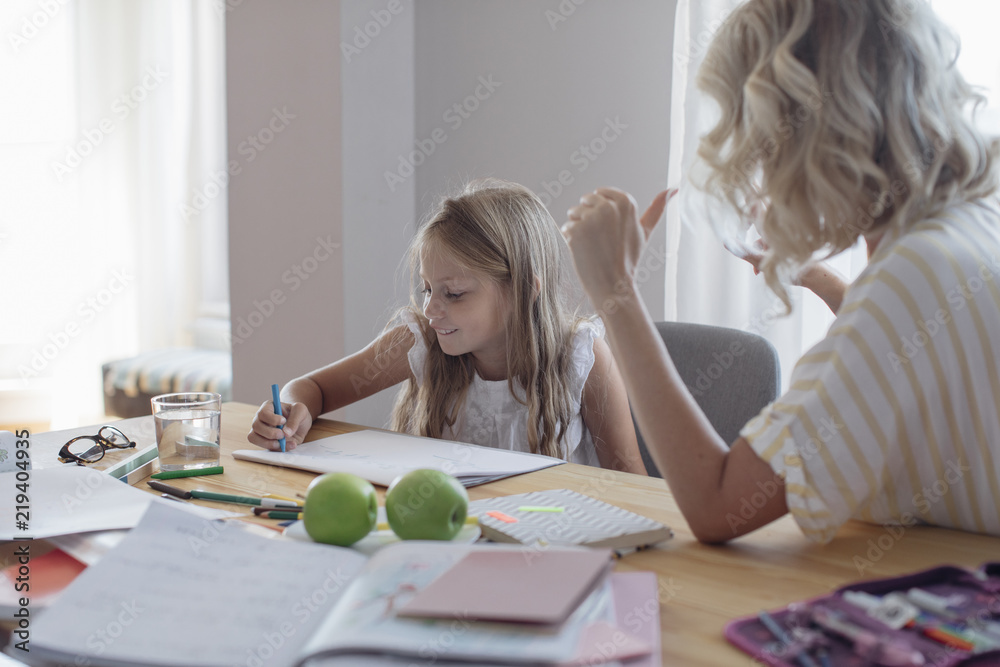 Mother and Daughter Studying at Home Mother and Daughter Studying at Home