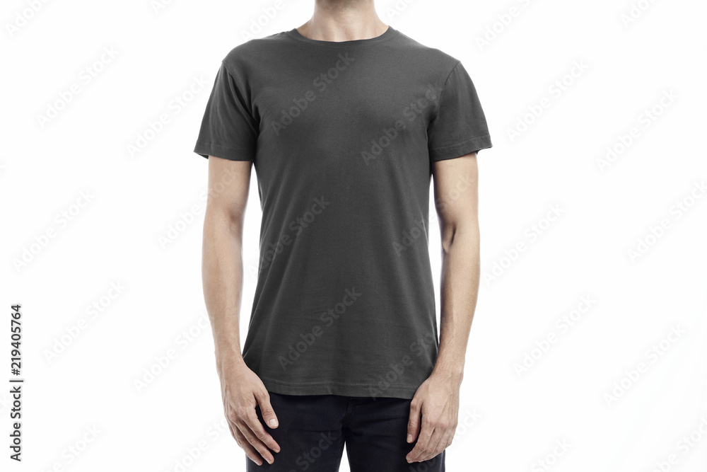 Man wearing a printable tshirt in grey color for mockup over white background Man wearing a printable tshirt in grey color for mockup over white background