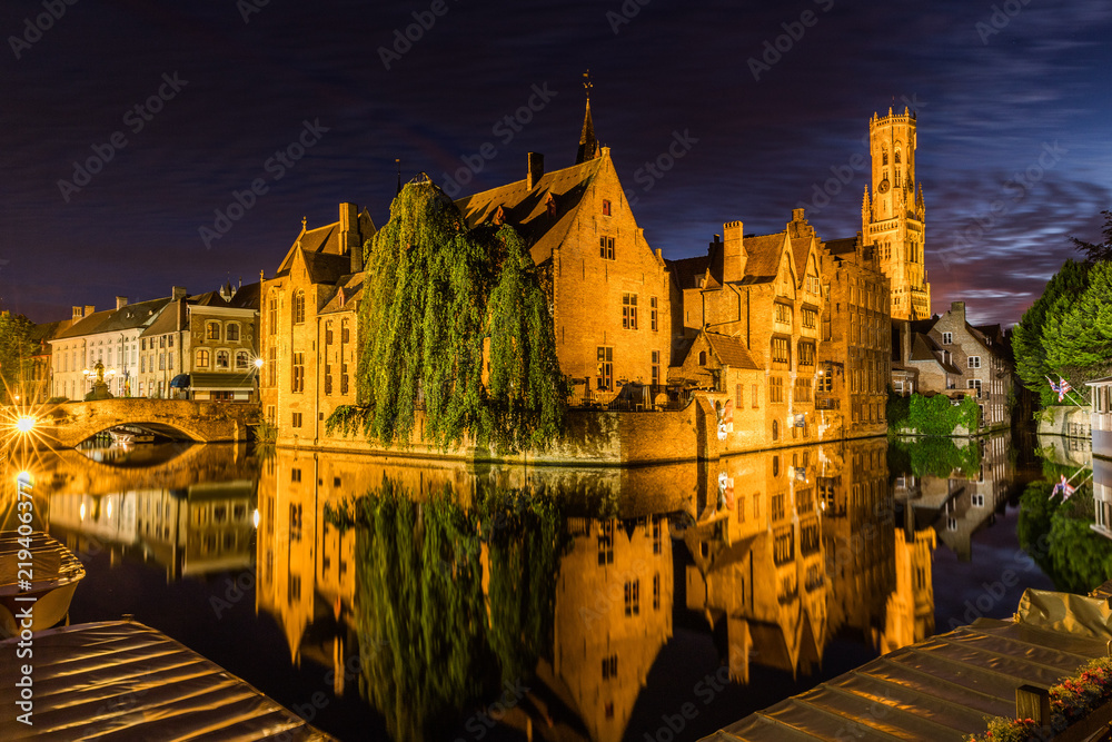Reflections in canal in Bruges, Belgium during the night