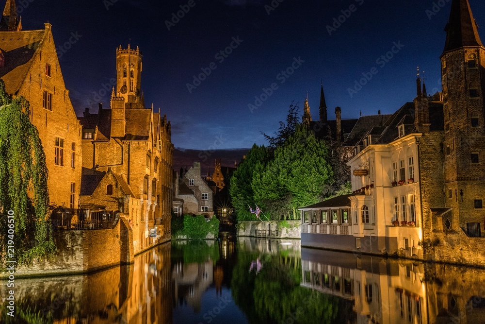 Reflections in canal in Bruges, Belgium during the night