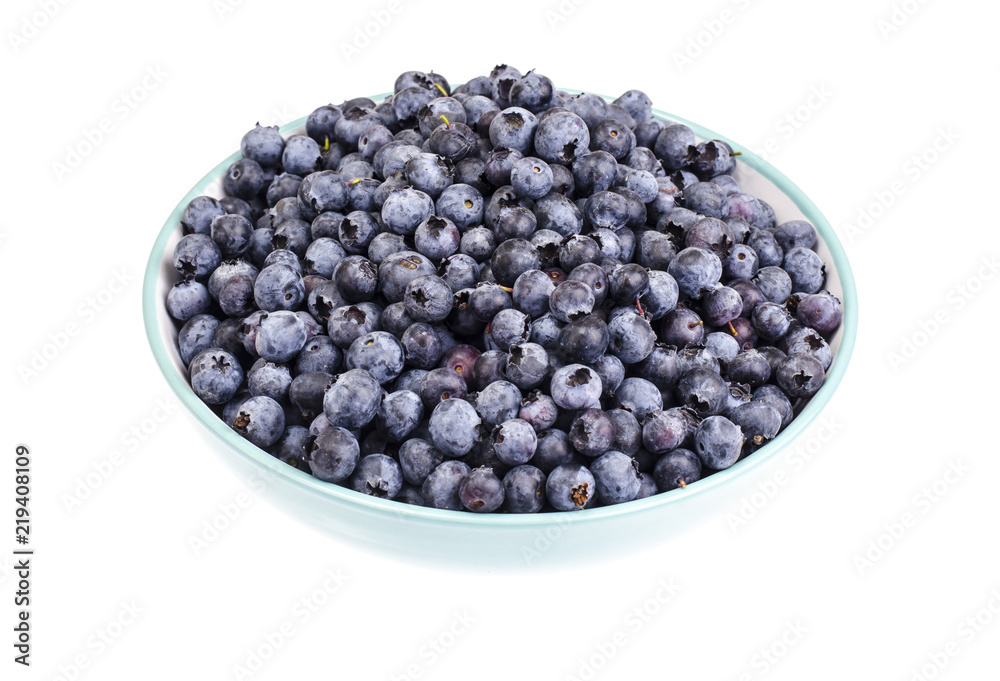 Lot of ripe blue blueberries in bowl Lot of ripe blue blueberries in bowl