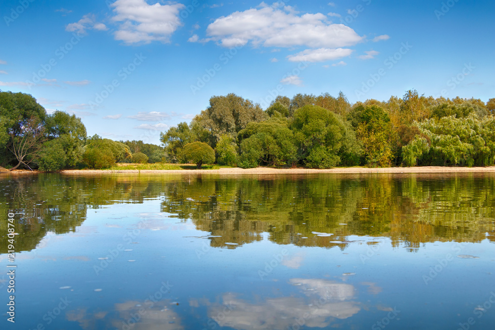 Beautiful summer landscape with a lake, trees and blue sky Beautiful summer landscape with a lake, trees and blue sky