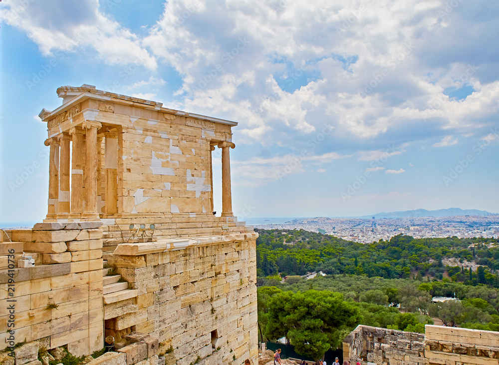 The Temple of Athena Nike, ancient Ionic temple depicting goddess Athena,  at the Athenian Acropolis, with the city of Athens in background. Athens,  Attica region, Greece. Stock Photo | Adobe Stock