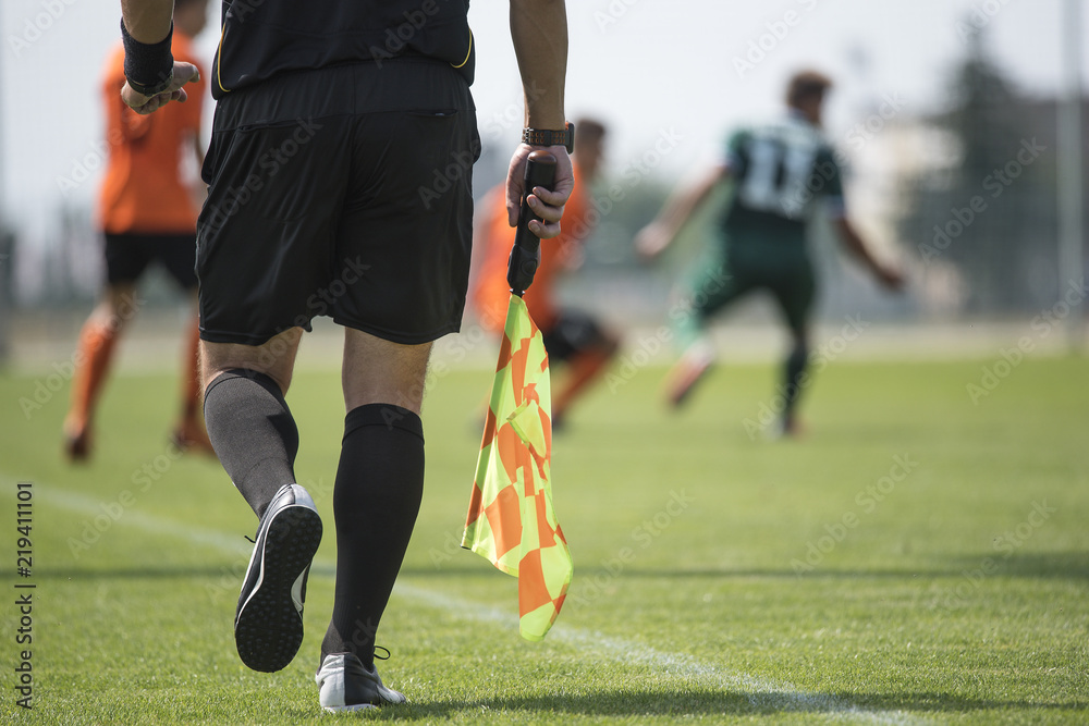 Legs of assistant of football referee with the flag Stock Photo | Adobe ...