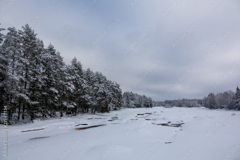 River and rapids of Koitelinkoski in Oulu, Finland. Winter scenery.