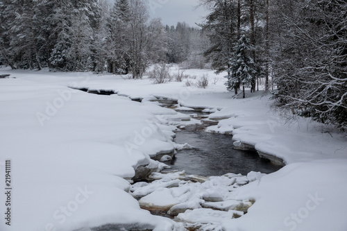 River and rapids of Koitelinkoski in Oulu, Finland. Winter scenery.