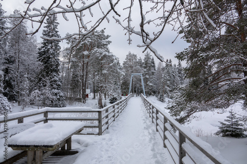 River and rapids of Koitelinkoski in Oulu, Finland. Winter scenery. photo