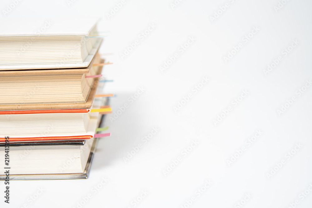 close up of book marked with placeholders on white background. close up of book marked with placeholders on white background.