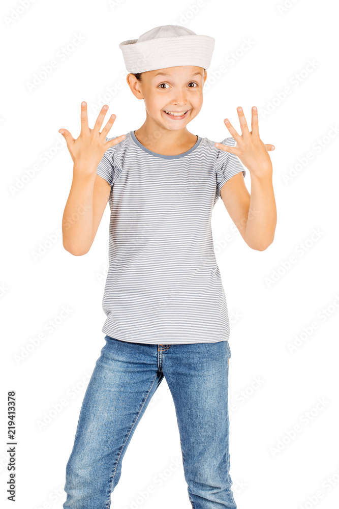 Little girl wearing a sailor costume and looking at the camera on white background. Little girl wearing a sailor costume and looking at the camera on white background.