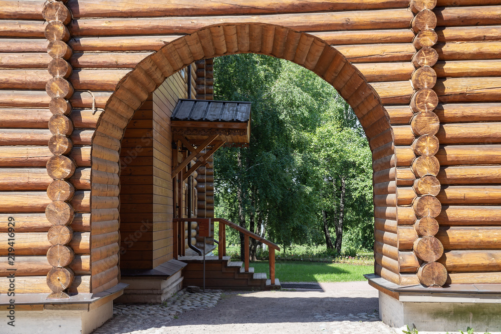 Arches in the courtyard of an old traditional Russian wooden house from logs Arches in the courtyard of an old traditional Russian wooden house from logs