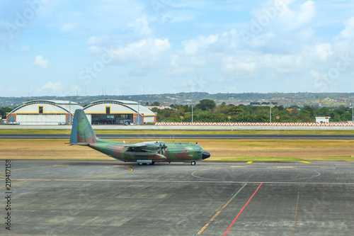 Military army aircraft at the airport on the runway
