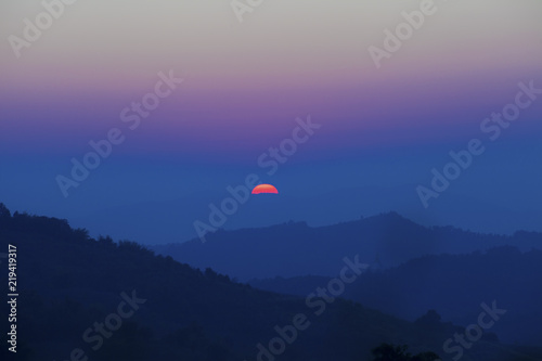 Rising sun from the mountain, Thailand.