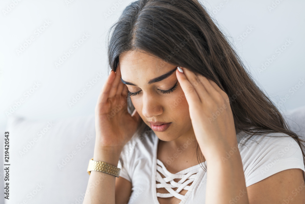 Woman having headache or dizziness problem. Health care and treatment concept. Woman having headache or dizziness problem. Health care and treatment concept.