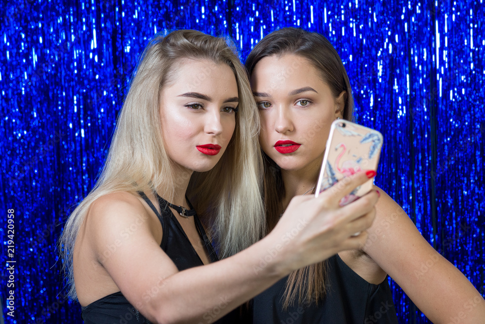 sexy girls with red lipstick on their lips do selfie on the phone sexy girls with red lipstick on their lips do selfie on the phone